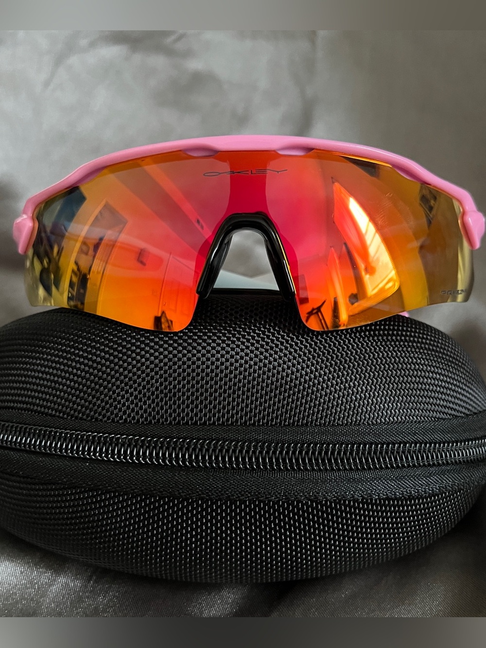 Oakley Pink Frame Sunglasses with Red-Orange Mirrored Lens